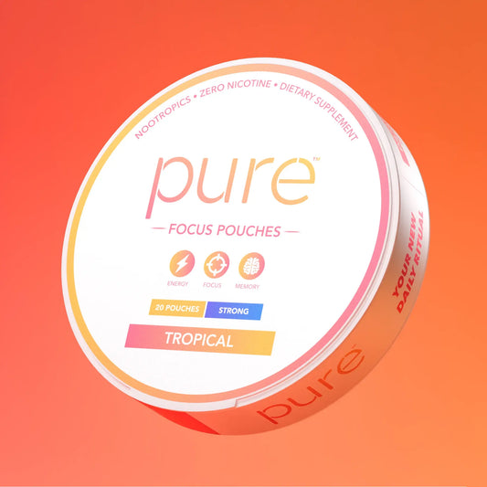 Pure Focus Pouches Tropical flavor, shown at an angle on a vibrant orange-to-pink gradient background. The packaging features the brand name 'pure' in a pink-to-orange gradient, with 'TROPICAL' printed on the front and side.